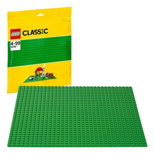 Green base plate for LEGO Classic, displayed on a table with a yellow packaging in the background.