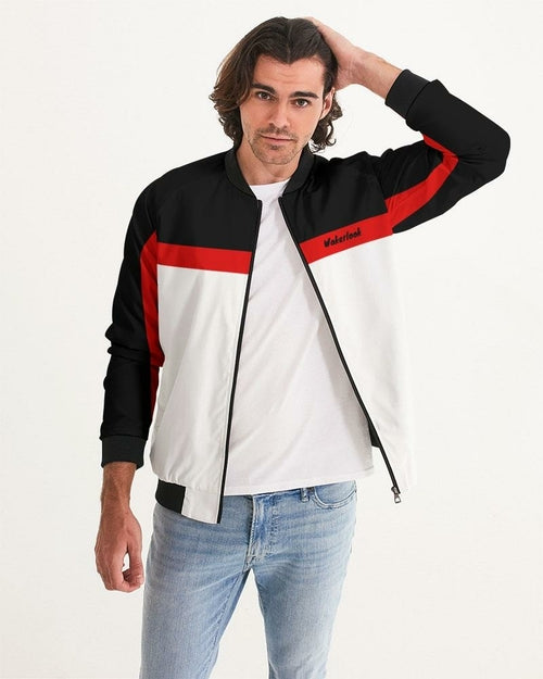 Men's bomber jacket in black, white, and red with ribbed cuffs and collar, worn over a white t-shirt and jeans.