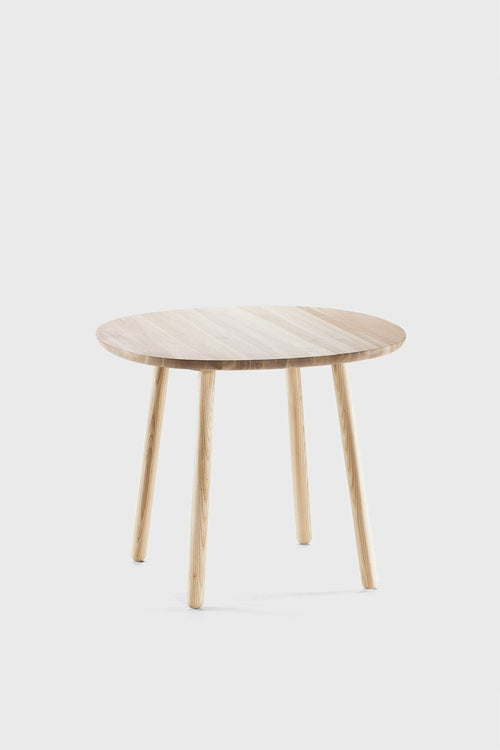 Round wooden dining table with a smooth, light-colored ash tabletop and sturdy, tapered legs.