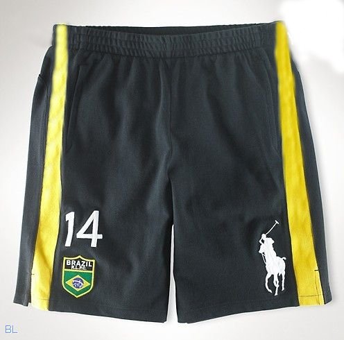 Svarta shorts med gula sidoränder, nummer 14 och vitt polospelarmotiv