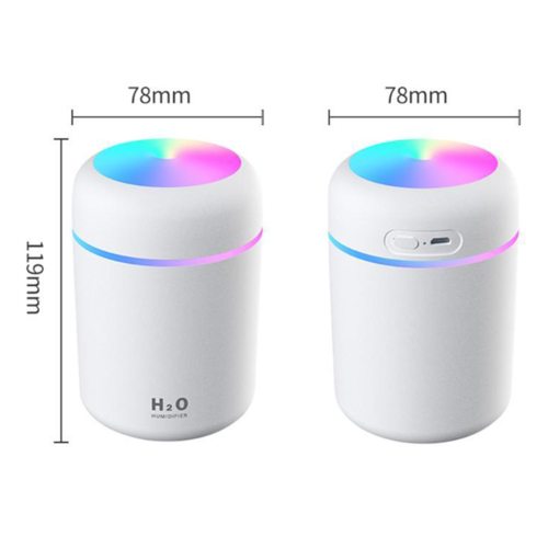 Compact white humidifier with a colorful top, featuring adjustable spray modes and a USB power option.