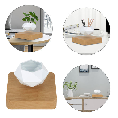 White geometric flowerpot on a light wood base, levitating and rotating, set on various indoor surfaces.