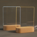 Wood table lamp with a wooden base and an acrylic message board, featuring a smooth design in warm and cool light settings.