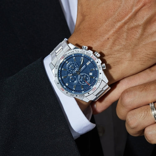 Stainless steel personalized men's watch with a blue dial, worn on a wrist, featuring luminous hands and sub-dials.