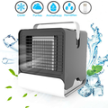 Compact USB Mini Negative Ion Cool Fan Air Conditioner in gray and white, featuring a portable handle and front grill, designed for cooling and humidifying.