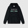 Svart unisexhoodie med Gucci-motiv och röda och gröna detaljer framtill